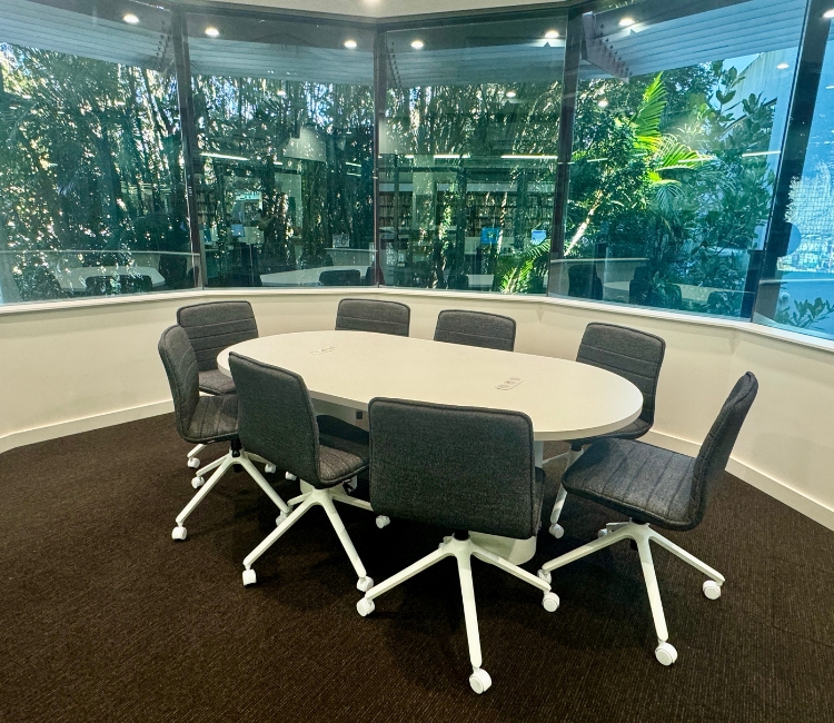 meeting room with oval table and office chairs
