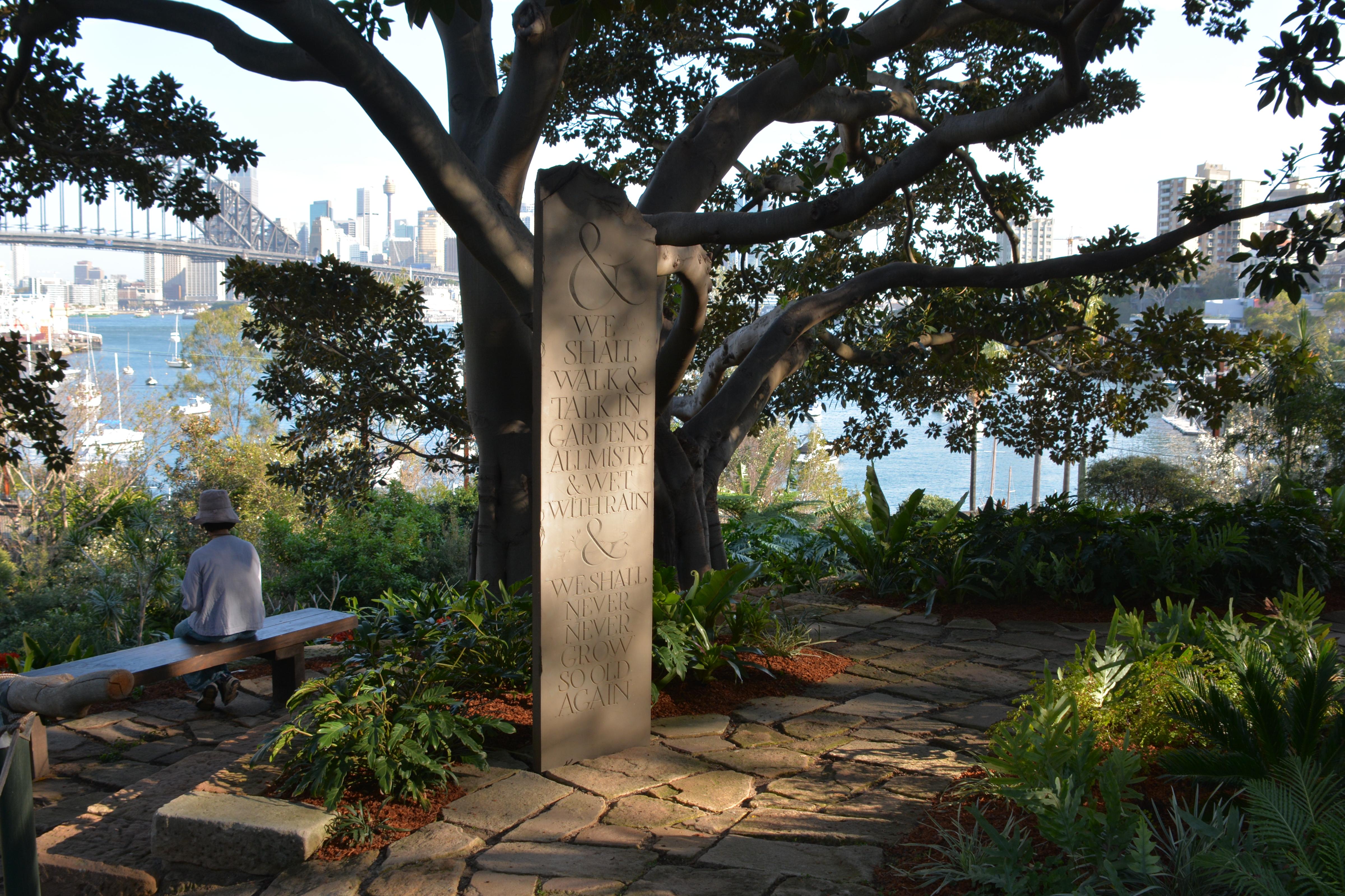 Sculptural plinth in front of tree with harbour bridge in background