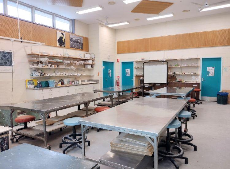 large art room, containing stainless steel trestle tables