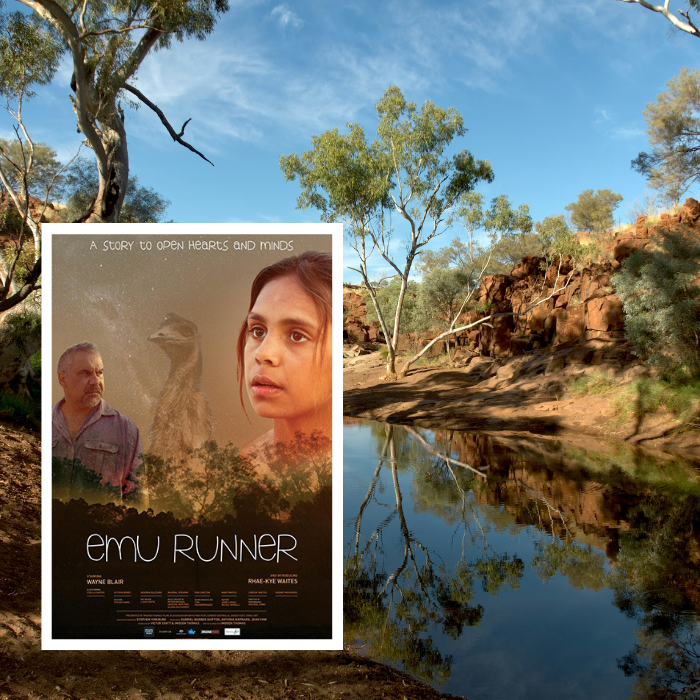 Movie poster for Emu Runner. Background is brown trees beside river under blue sky during daytime