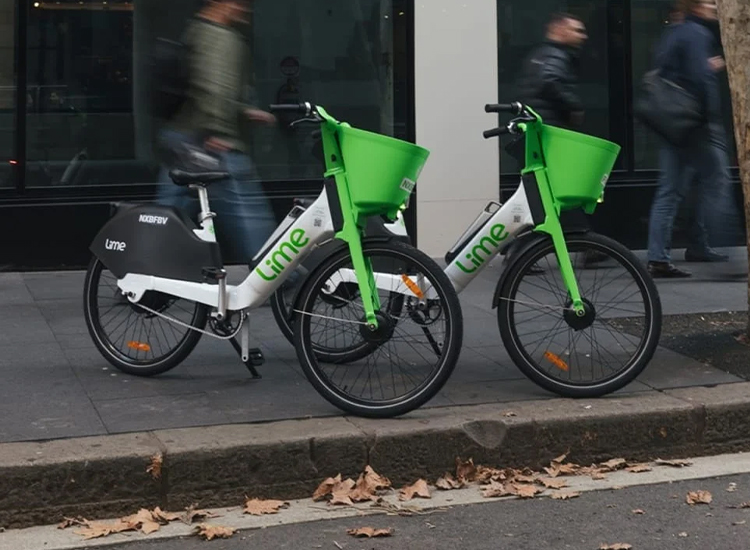 lime bikes parked on a footpath in Sydney